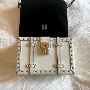 Very cute BCBG small clutch with gold chain and hardware. Comes with dustcover.